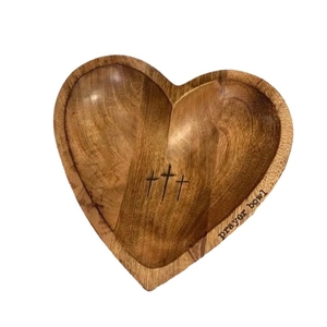 Handcrafted heart-shaped wooden prayer bowl with engraved crosses and natural grain