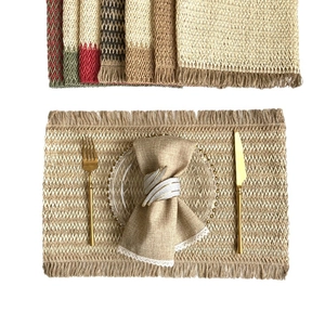 Handwoven jute placemats with herringbone pattern, fringe edges and festive color accents
