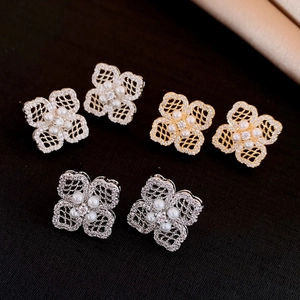 18K gold plated clover earrings featuring lace metal texture and white pearls