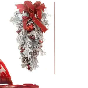 Detail view of 45cm Christmas teardrop wreath with red bow, pine cones and flocked needles