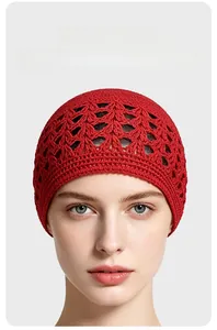 Close-up of red crochet wheat ear pattern beanie made of breathable hollow knit polyester