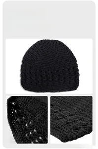 Detail shot of black hand-crochet knit beanie showing intricate hollow mesh wheat patterns