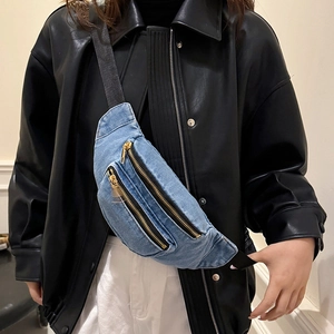 Vintage washed blue denim chest bag with gold zippers and adjustable black nylon strap