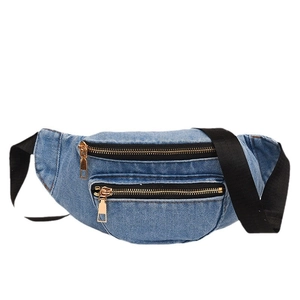 Minimalist light blue denim crossbody fanny pack with dual gold metal zippers and black strap