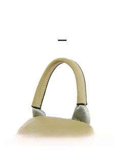 Detail of soft beige lychee leather backpack with reinforced nylon top handle