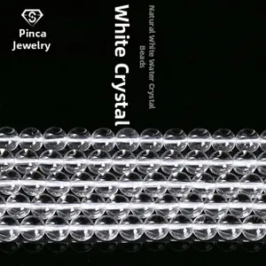 Macro view of clear natural white crystal round beads for DIY jewelry making