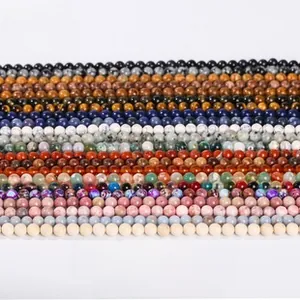 Close-up of assorted natural gemstone round beads in various colors for DIY jewelry making