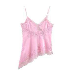 Detail of pink satin camisole showing delicate lace trim and irregular hemline