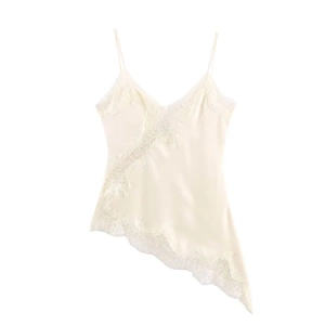 Close-up of cream satin camisole featuring delicate lace trim and asymmetric V-neckline