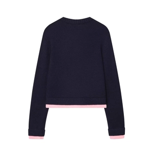Back view of navy blue knit sweater featuring stylish pink contrast rib-knit trim