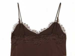 Detail of eyelash lace neckline and spaghetti straps on a dark coffee camisole top