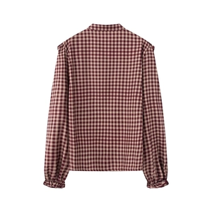 Rear view of long sleeve plaid shirt with red and white checks and pleated cuffs