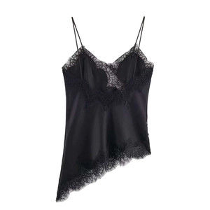 Detail of black satin camisole featuring delicate eyelash lace trim and asymmetric hem
