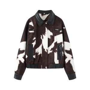 Vintage cow print jacket with contrast leather collar and zip pockets on white background