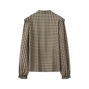 Detail of vintage green gingham shirt showing the back seams and elastic frill cuffs