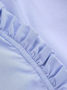 Macro detail of blue and white striped shirt fabric with fine ruffle edge stitching