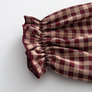 Plaid long sleeve shirt with ruffled elastic cuffs in red and beige gingham fabric