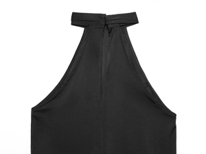 Close-up of black halter neck top featuring a vertical cutout detail and refined stitching