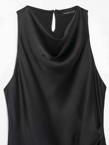 Detail of black satin sleeveless top with cowl neck design and silky smooth texture