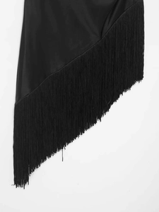 Close-up of black sleeveless top featuring satin fabric and long fringe tassel detail
