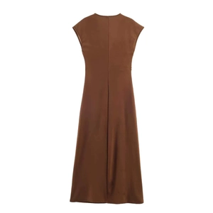 Close-up of the back seam detail on a dark brown satin sleeveless midi dress