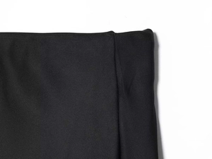 Detailed close-up of the black satin skirt waist area showing twill fabric texture