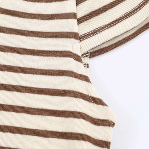 Detailed view of coffee and beige striped ribbed knit fabric with neat stitching seams