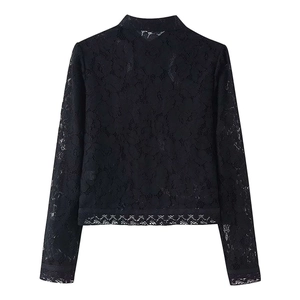 Close-up of black floral lace top featuring traditional Chinese frog button and stand collar