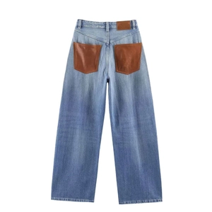 Vintage high waist wide leg jeans in light blue wash with brown leather back pockets