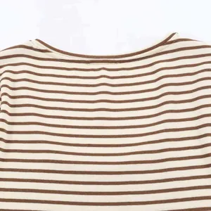 Detailed view of the U-neckline and coffee striped knit texture of the summer t-shirt
