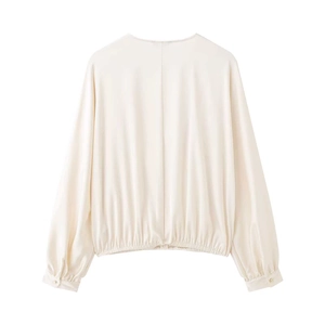 Blouse courte élégante à manches bouffantes crème avec boutons dorés en satin poli