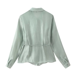 Back view of elegant sage green satin long sleeve shirt with waist tie detail