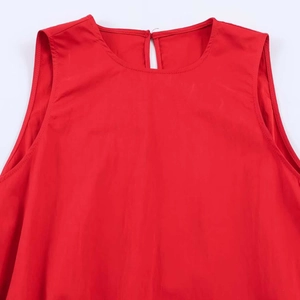 Detail of red sleeveless midi dress neckline featuring a teardrop cutout back and round collar