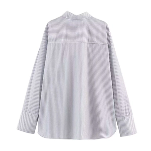 Detail of striped poplin shirt showing horizontal stripe patchwork on yoke and cuffs