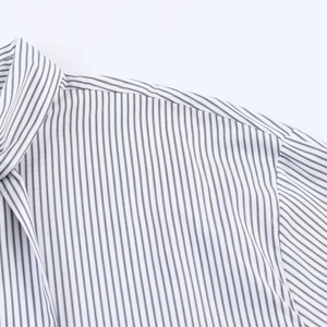 Detailed close-up of the collar and striped poplin fabric on this long sleeve shirt