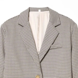 Classic brown houndstooth blazer for women featuring notched lapels and single-button closure