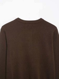 Detail of the dark brown round neck ribbed collar and fine knit texture on this cardigan