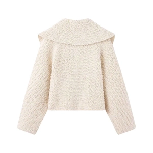 Back view of cream bouclé knit jacket featuring an oversized lapel and cozy cropped fit