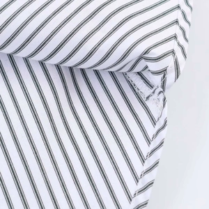 Close-up of stripes and stitching detail on breathable striped poplin shirt fabric
