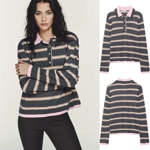 Detail view of striped polo knitwear with pink ribbed collar and cuffs for women
