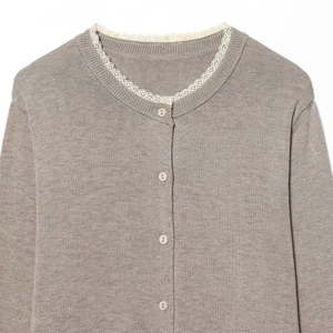 Gray knitted cardigan with a round neckline and delicate white lace trim detailing