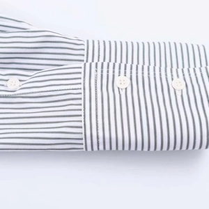 Detailed macro view of striped poplin shirt cuffs with two white buttons and neat stitching