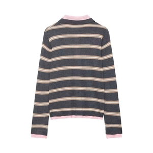 Striped long sleeve knit sweater with contrast pink trim on a white background