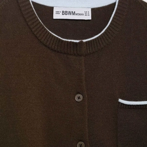 Minimalist dark brown knit cardigan with blue contrast trim and round buttons