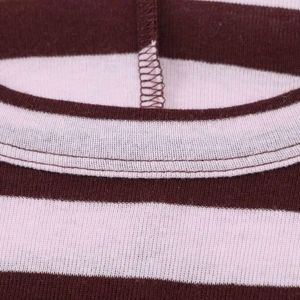 Detail shot of the ribbed crew neck and brown striped pattern on a knit t-shirt