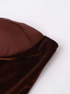 Detail of dark brown velvet corset featuring premium fabric stitching and stitching craftsmanship