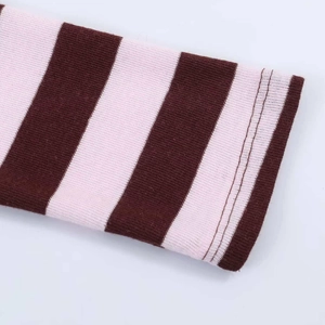 Detail of pink and brown striped knit fabric with professional double-needle stitching