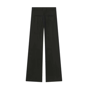 Macro shot of back detail on black wide-leg suit trousers with pockets and crease