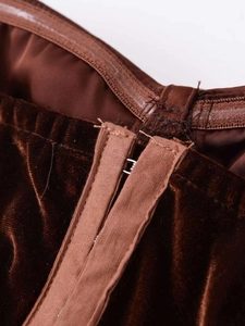 Detail of dark brown velvet corset top with hook-and-eye closure and anti-slip silicone