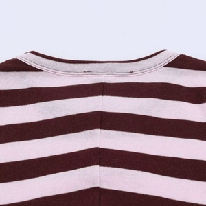 Detail view of reinforced crew neckline and fine stitching on striped knitted t-shirt